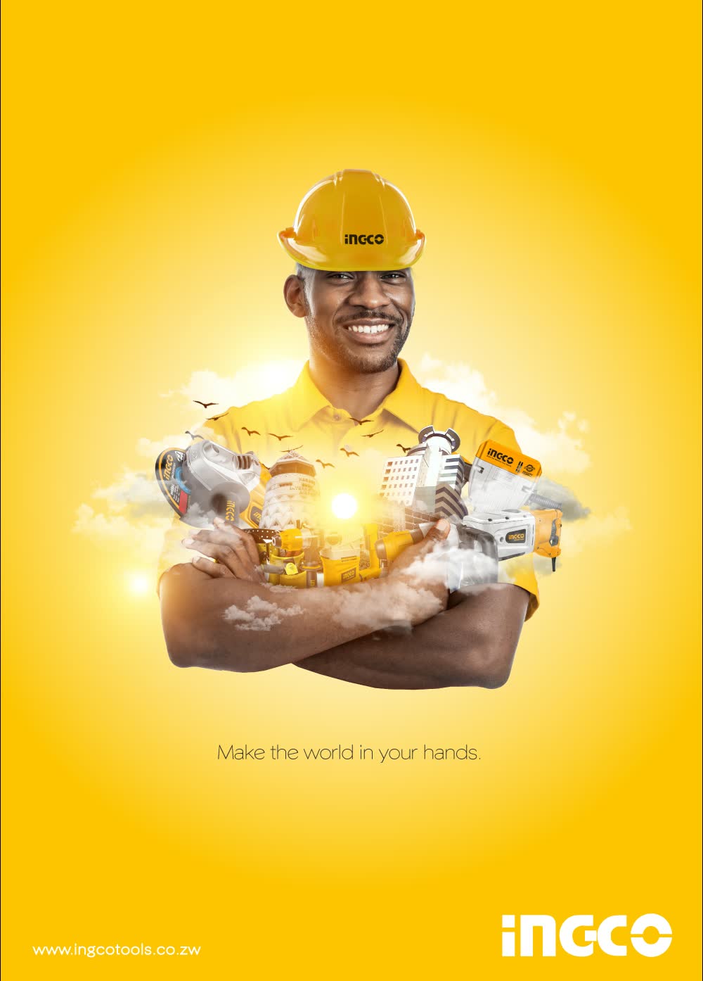 A builder in a yellow hard hat with a miniature city in his hands